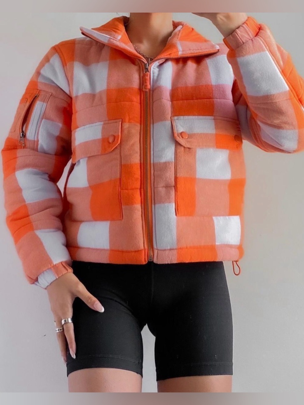BDG women’s Flannel Puffer Jacket in an orange and light blue plaid XS